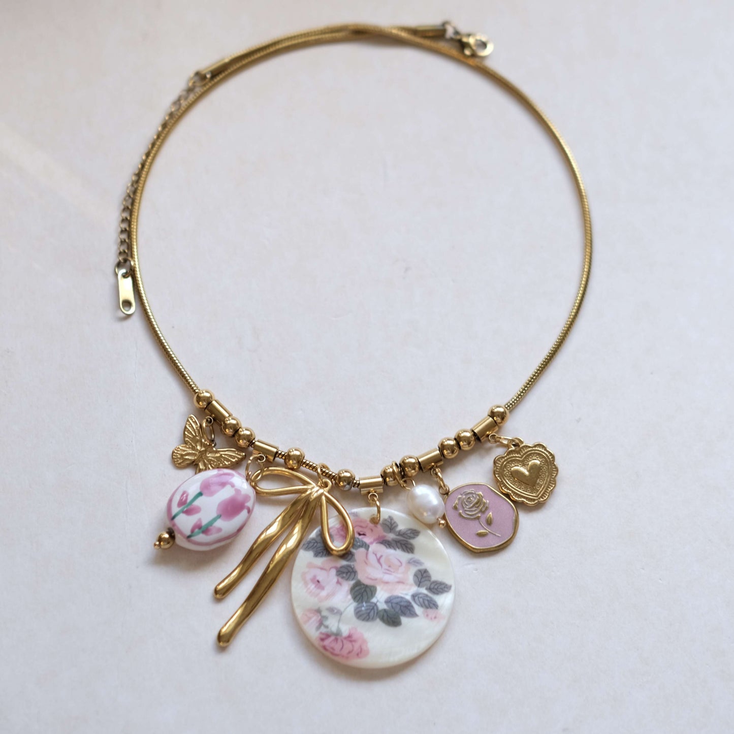 Floral Charm Necklace with Bow & Pearl Accents