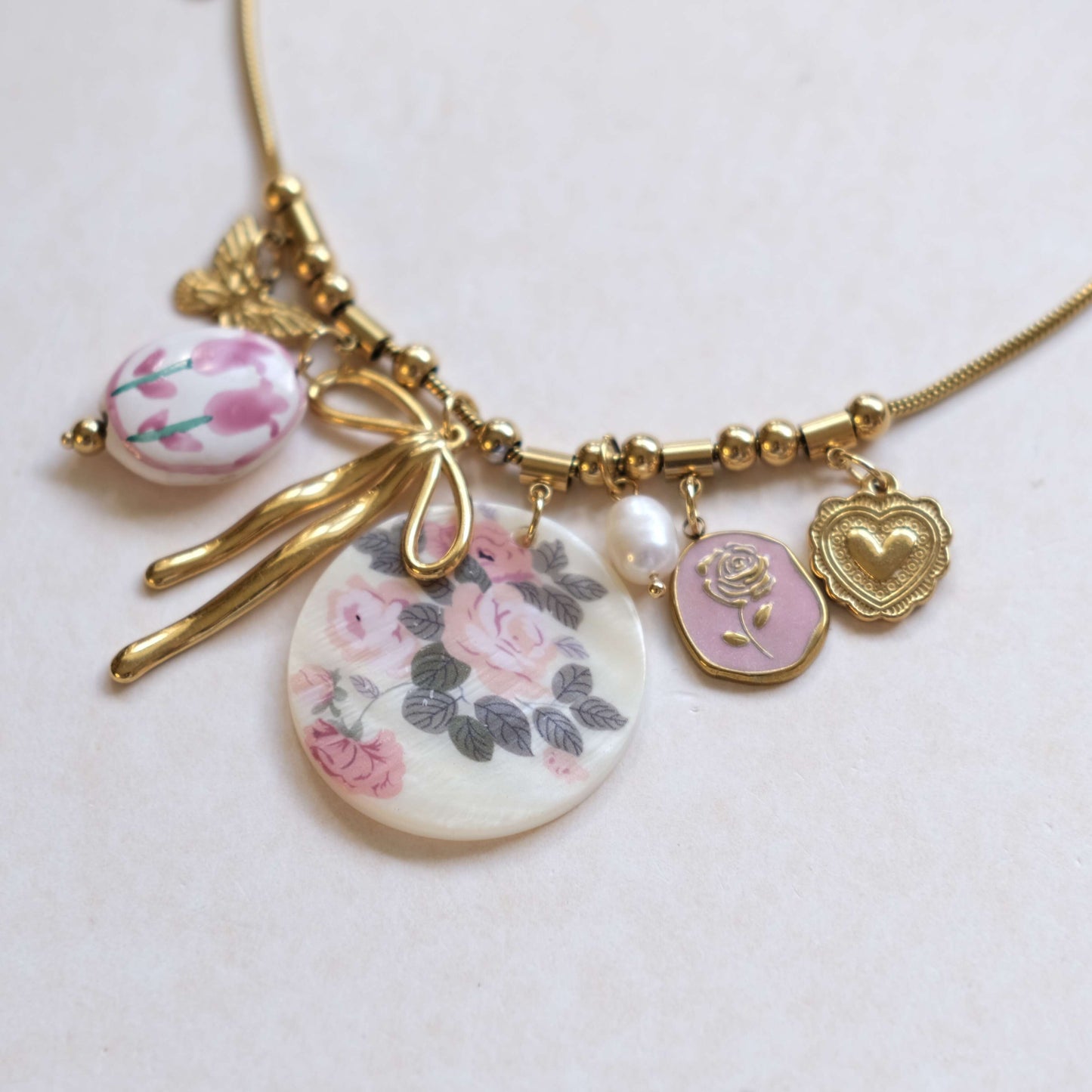 Floral Charm Necklace with Bow & Pearl Accents