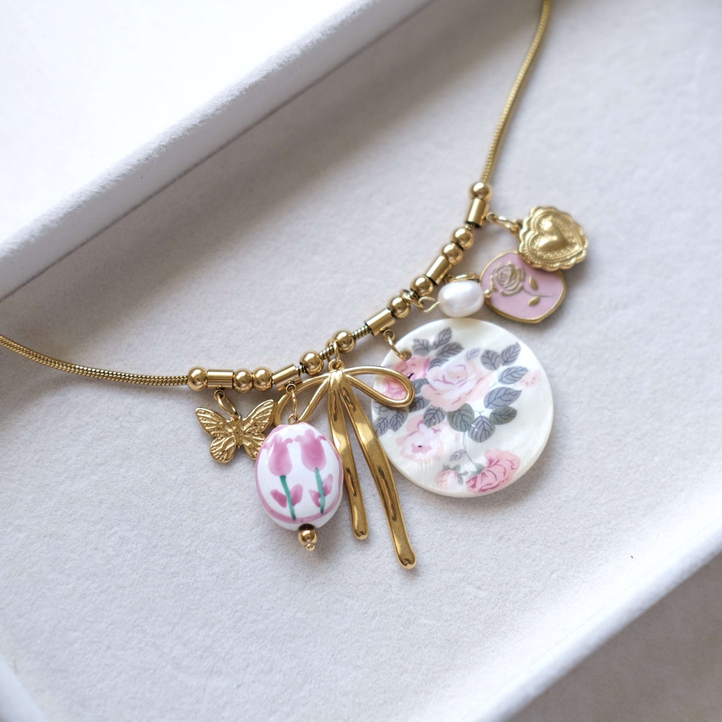 Floral Charm Necklace with Bow & Pearl Accents