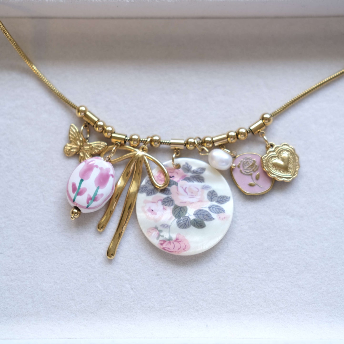 Floral Charm Necklace with Bow & Pearl Accents